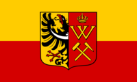 Historyczna flaga Królewskiej Huty z herbem