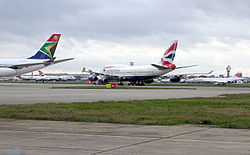 View across Heathrow Airport. The Concorde is G-BOAB in open-air storage.