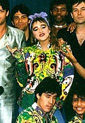 Madonna smiling, surrounded by dancers