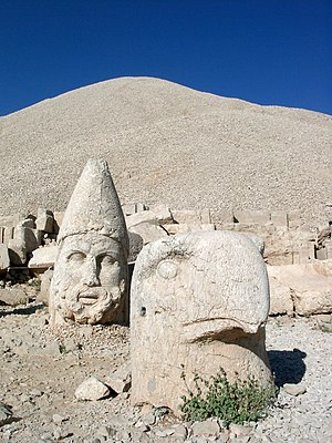 Statues of gods and the pyramid-like tomb-sanc...