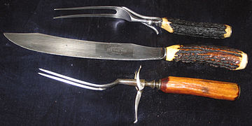 A carving knife with carving forks