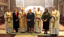 Keith Newton, John Broadhurst, Burnham (far right), and their wives, with Bishop Alan Hopes following their ordination as Roman Catholic deacons Ordenacao anglocatolica 013.jpg
