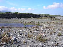 A former quarrying landscape, with level ground and a small pond