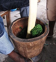 Cassava leaves contain cyanide and can thus cause poisoning if not prepared correctly. Saka-saka - cassava leaves in mortar and pestle.jpg