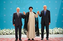 Putin with Iranian president, Ebrahim Raisi and Turkish president Recep Tayyip Erdogan in Tehran, 19 July 2022 Three leaders (2022-07-19).jpg