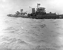 Minesweeper USS Tide after striking a mine off Utah Beach, 7 June 1944. Note her broken back, with smoke pouring from amidships. USS Tide sinking.jpg