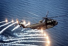 CH-53D releasing flares near Naval Air Station Patuxent River, 1982 CH-53D Sea Stallion spewing flares.jpg