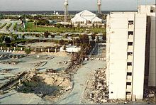 The crater remaining after the truck bomb explosion. Building #131 is on the right. Khobar towers and crater.jpg