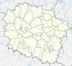 Mapa konturowa województwa kujawsko-pomorskiego, w centrum znajduje się punkt z opisem „Miasteczko Uniwersyteckie Uniwersytetu Mikołaja Kopernika w Toruniu”