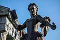 Bronze sculpture of Mercy Otis Warren stands to the right of the courthouse entrance