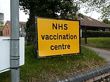 A sign for a vaccination centre. NHS Vaccination Centre Sign.jpg