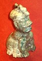 A small jade were-jaguar figurine. Stand-alone were-jaguar figurines are rare - most were-jaguar figurines show a were-jaguar baby accompanied by a human adult. Height: 8.6 cm (3.4 in).