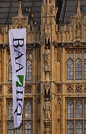 Plane Stupid activists on the roof of the Palace of Westminster Plane Stupid on Palace of Westminster.jpg