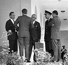 President Kennedy and his advisors discuss the Cuban Missile Crisis. Part of the US response to Soviet missiles being placed in Cuba was a naval blockade of the island. President Kennedy with advisors after EXCOMM meeting, 29 October 1962 crop.jpg