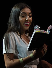 Rupi Kaur reading from her book milk and honey in Vancouver in 2017