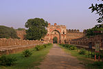 Sher Shah Suri's gate with the adjoining curon walls and Bastions and the remains of the double line of structure to its front