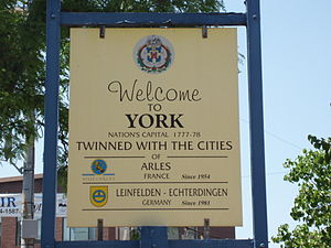 A "welcome sign" featuring York's tw...