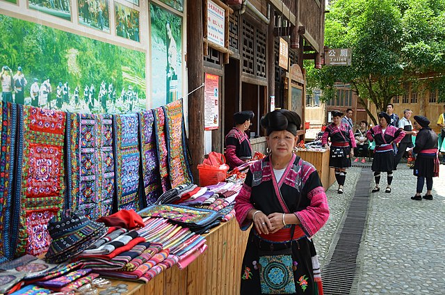Woman selling textiles at an outdoor market