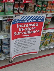 Sign notifying shoppers of increased surveillance due to a perceived increased risk of terrorism 1080 Poisoning Scare At New World in Wellington.jpeg