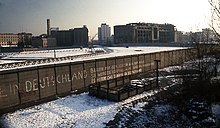 East Germany erected the Berlin Wall to prevent emigration westward. Berlin Wall Potsdamer Platz November 1975 looking east.jpg