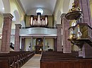 Vue intérieure de la nef vers la tribune d'orgue