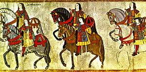 Officers of the College of Arms riding in procession to the Westminster Tournament, from a tourney roll, made during the reign of King Henry VIII in 1511. The pursuivants to the left are identified by their reversed tabards, while the figure in the right (with the black hat) is probably Garter King of Arms Sir Thomas Wriothesley. English Officers of Arms 1511.jpg