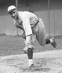 A man in a light baseball uniform