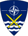 емблема НАТО на шевроні Штаб-квартири Союзних Сухопутних військ (Шлезвіг-Гольштейну і Ютландії)