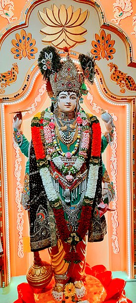 Lord Rama (center) with wife Sita (to his left), brother Lakshmana (to his right) and devotee Hanuman.