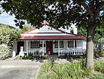This historical cottage, built of wood and corrugated iron, is the only remaining building from the days of the discovery of gold at Millwood, Knysna which was proclaimed a gold field in 1886. Type of site: House Previous use: House. Current use: Museum. This historical cottage, built of wood and corrugated iron, is the only remaining building from the days of the discovery of gold at Millwood, Knysna which was proclaimed a gold field in 1886.
