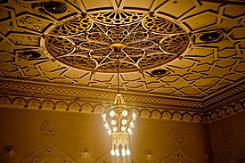 Detail of the ceiling with one of the lights and arabesque motifs NYC Center 2319348141 9d7ca25455.jpg