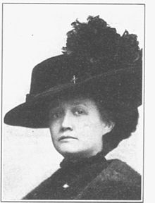 A black and white photograph of a woman, Ola Delight Smith, shot from the chest up, wearing a hat