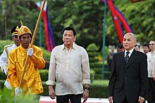 Philippine President Rodrigo Duterte with King Norodom Sihamoni at the Royal Palace in Phnom Penh on 14 December 2016. President Rodrigo Roa Duterte is welcomed by the King of Cambodia Norodom Sihamoni upon his arrival at the Royal Palace in Cambodia.jpg