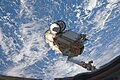 Canadarm2 transfers MRM-1 to the Earth-facing port of the Zarya module.