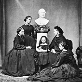 The five daughters of Prince Albert wore black dresses and posed for a portrait with his statue following his death in 1861. The royal children in mourning Mar 1862.jpg