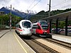 A departing InterCityExpress next to a regional train at Landeck-Zams in 2007