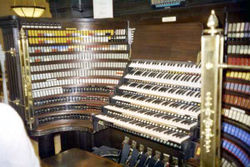 The console of the Wanamaker Organ in the Macy's (formerly Lord and Taylor) department store  in Philadelphia, featuring six manuals and color-coded stop tabs.