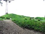 A gravel path and hillocks.