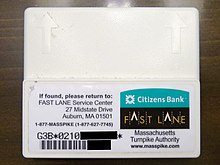 An E-ZPass system transponder unit, also known as a tag or a pack, was distributed by the Massachusetts Turnpike Authority for use with their E-ZPass-compatible Fast Lane system and other roads which utilize E-ZPass. E-ZPass MA Transponder (Fast Lane) (cropped).JPG