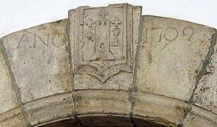 Escudo sobre la puerta de la casa Abadía