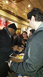 Whitaker signing playbills after making his Broadway debut in Hughie (2016) Forest Whitaker (24597168424).jpg