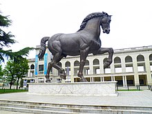 The statue of Leonardo's horse, which is located in front of the Hippodrome of San Siro in Milan Ippodromo del Galoppo - panoramio.jpg