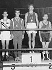 Oliver Taylor (primul din stânga) a cucerit medalia de bronz la Jocurile Olimpice de vară 1960. L-a învins la puncte pe Nicolae Puiu cu decizia de 3-2, în cel de-al doilea meci disputat. Alături de el pe podium, Brunon Bendig, Oleg Grigoryev și Primo Zamparini câștigătorul medaliei de aur