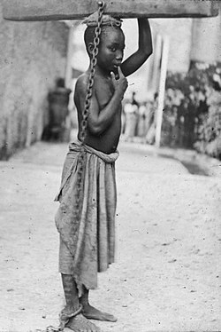 Photograph of a slave boy in the Sultanate of Zanzibar. 'An Arab master's punishment for a slight offence.' c. 1890. From at least the 1860s onwards, photography was a powerful weapon in the abolitionist arsenal. Slavezanzibar2.JPG