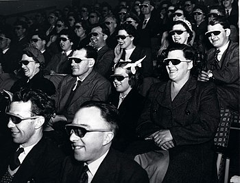 Audience wearing special glasses watch a 3D "stereoscopic film" at the Telekinema on the South Bank in London during the Festival of Britain 1951. The National Archives UK - WORK 25-208.jpg