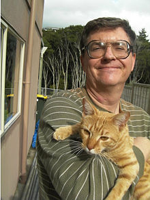 Picture of a man holding a cat.