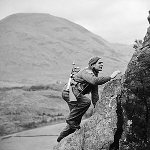 A soldier from No. 1 Commando climbs up a steep rock face during training at Glencoe, Scotland, 19 November 1941. A soldier from No. 1 Commando climbs up a steep rock face during training at Glencoe in Scotland, 19 November 1941. H15667.jpg