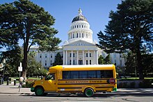 The first all-electric school bus in the state of California pausing outside the California capitol building in Sacramento First New Zero-Emission School Bus in California.jpg