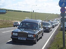 Christian funeral procession by car in Brighton and Hove, East Sussex, England, 2009 Henry Allingham Funeral Procession 01.jpg