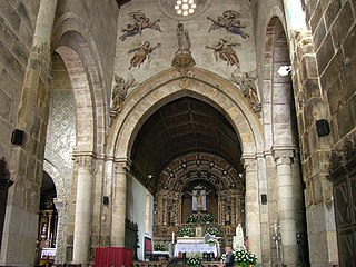 Columns and arches of the Church of São Salvador de Paderne, where groups of attached shafts support each arcade.